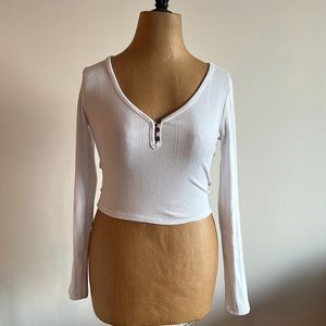 White, stretchy, cotton scoop-neck, long sleeve.